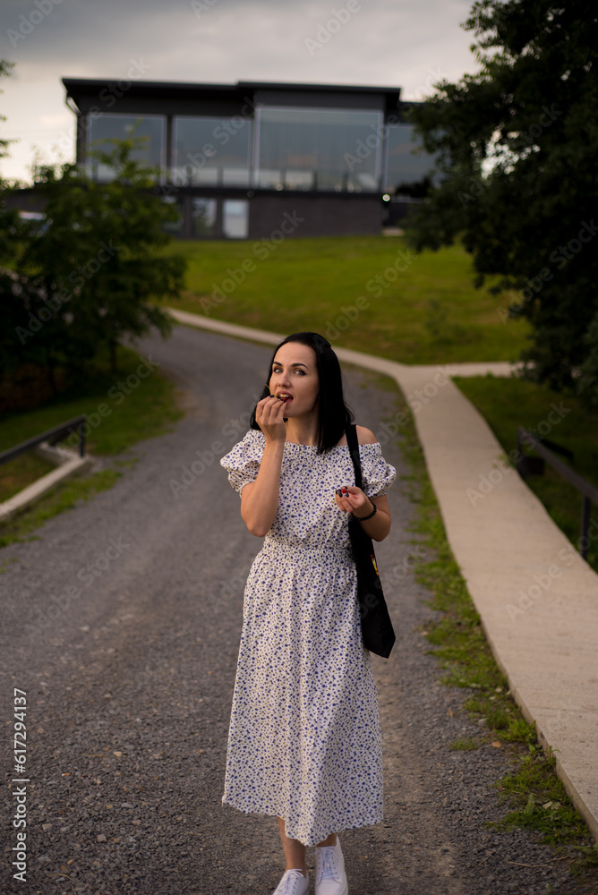 Beautiful woman eating cherry berries for fun Beautiful woman eating cherry berries for fun