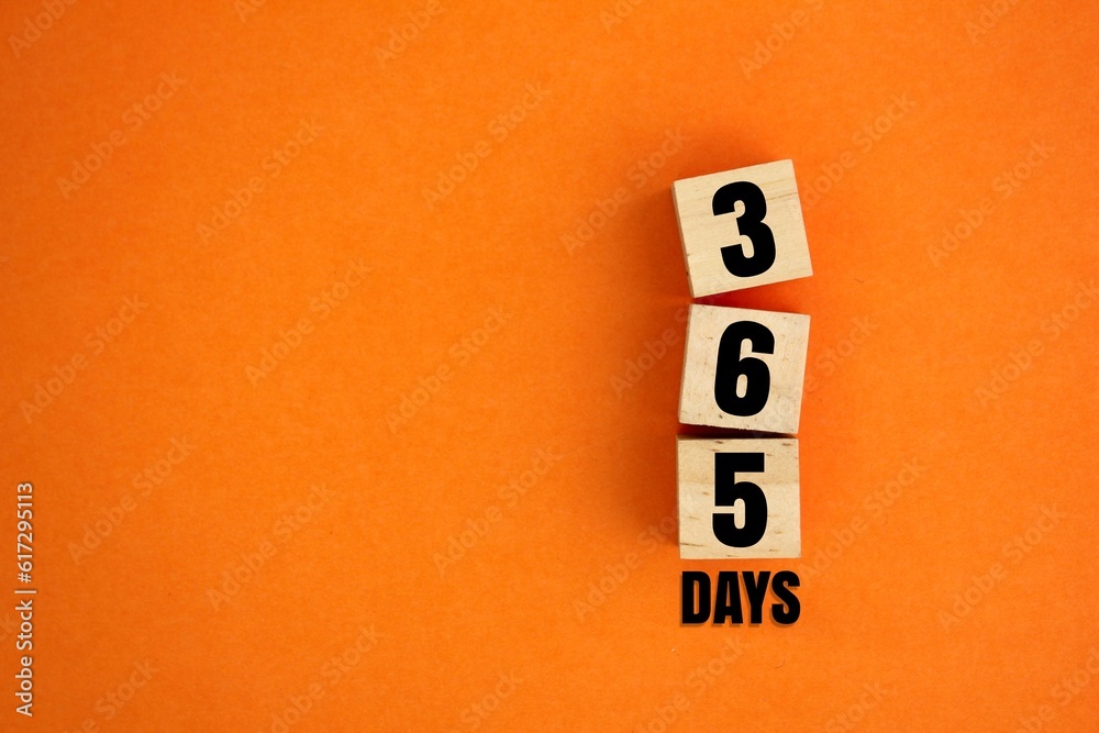 wooden cube with words or numbers of 365 days. the concept of counting