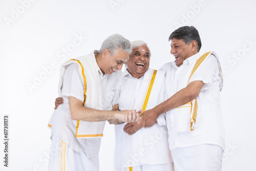 South indian senior male friends having fun isolated on white background