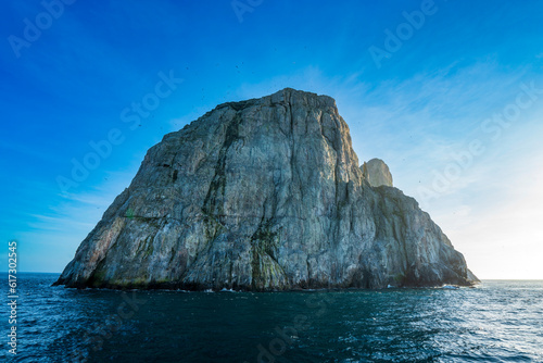 Malpelo, UNESCO World Heritage Site of Colombian Pacific. Incredible landscape and seascape and beautiful light of rocky offshore islands. An improved edit. photo