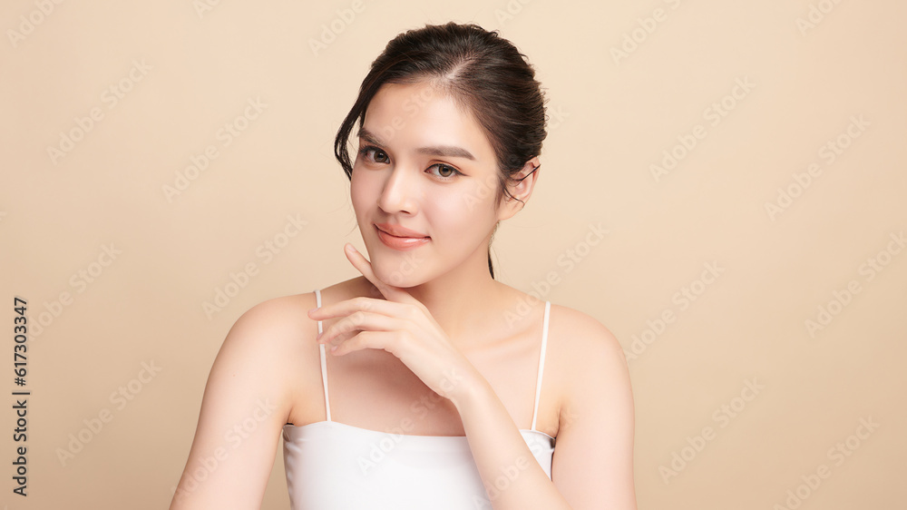Beautiful young asian woman with clean fresh skin on beige background, Face care, Facial treatment, Cosmetology, beauty and spa, Asian women portrait. Beautiful young asian woman with clean fresh skin on beige background, Face care, Facial treatment, Cosmetology, beauty and spa, Asian women portrait.