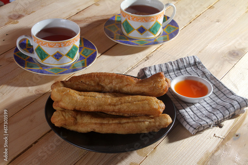 A plate of Cakwe or Cakue. Cakwe is one of the traditional Chinese snacks with a savory taste
 photo