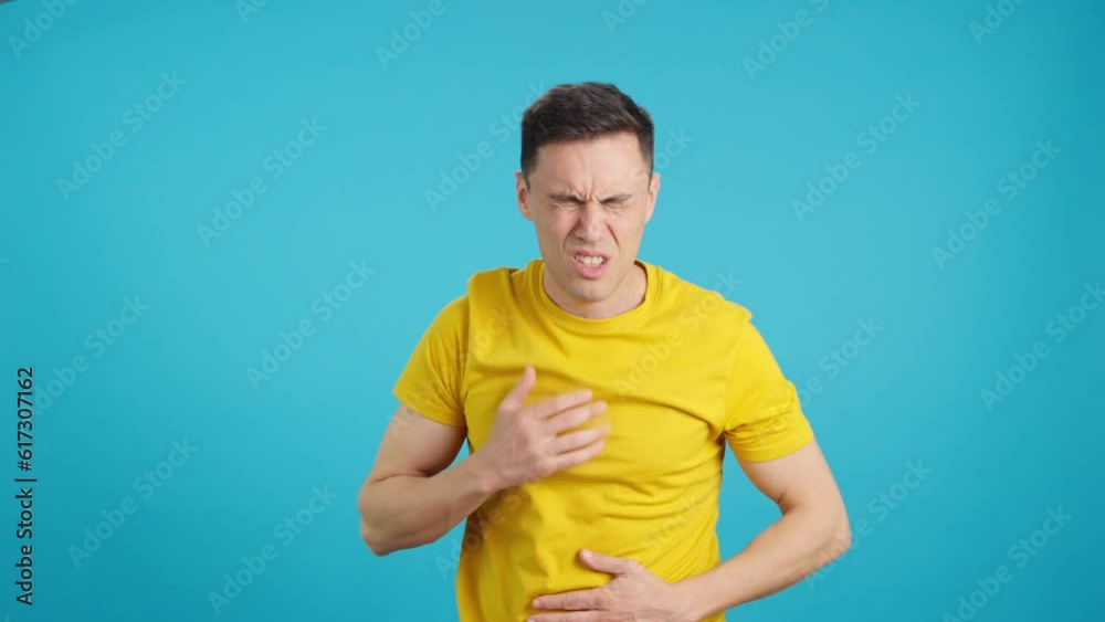 Man gesturing that wants to throw up and feels sick Man gesturing that wants to throw up and feels sick