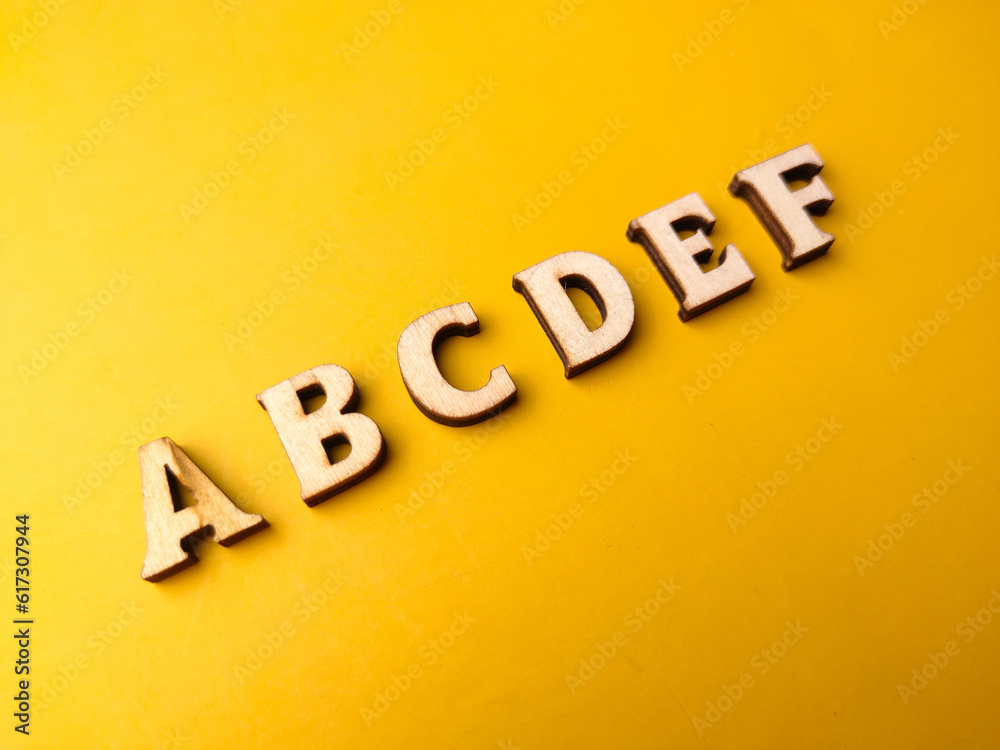 Wooden letter toy arranged the word ABCDEF Wooden letter toy arranged the word ABCDEF