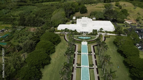 Slow aerial zoom out over Laie Hawaii LDS Temple in Oahu, Hawaii. Establishing. photo