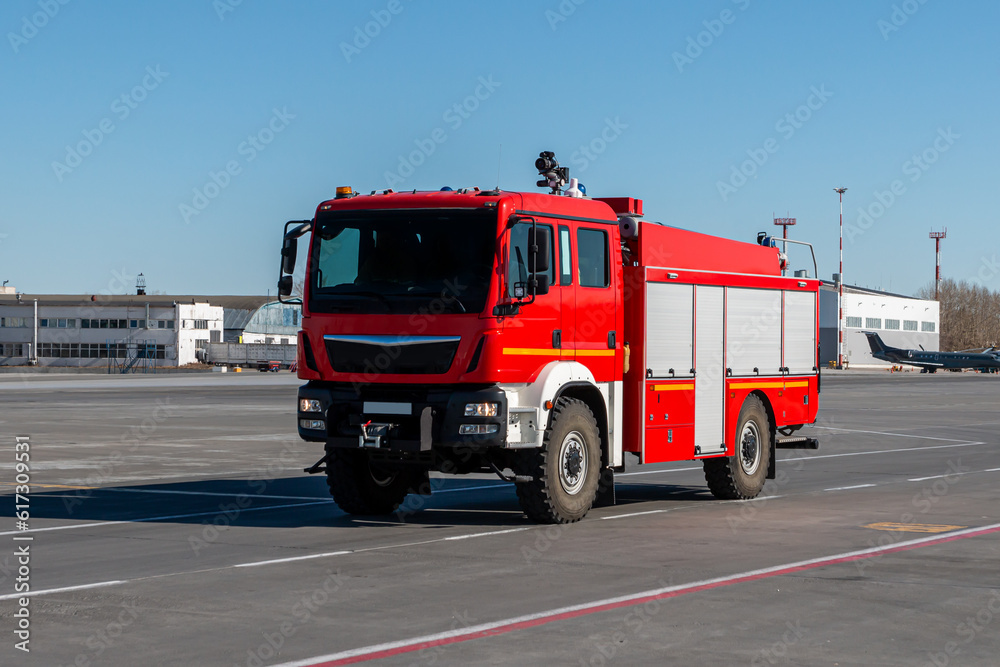 Red airfield firetruck at the airport
