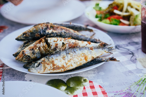 Wallpaper Mural Grilled sardines on a plate, bread, salad, festival "Santos Populares" in Lisbon, Aflama Torontodigital.ca