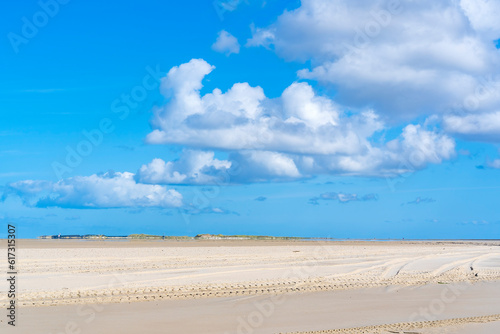 During low tide this sand plain De Vliehorst on the island of Vlieland contrasts beautifully against the blue sky