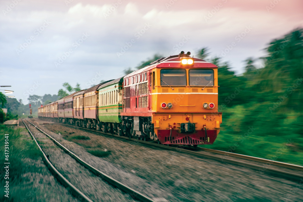 Fototapeta premium Passenger train by diesel locomotive on the railway.