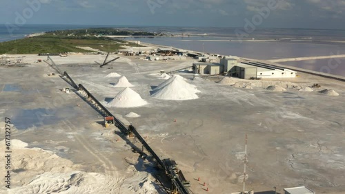 Coastal saltern with mounds of dried salt and saltworks in Yucatan.