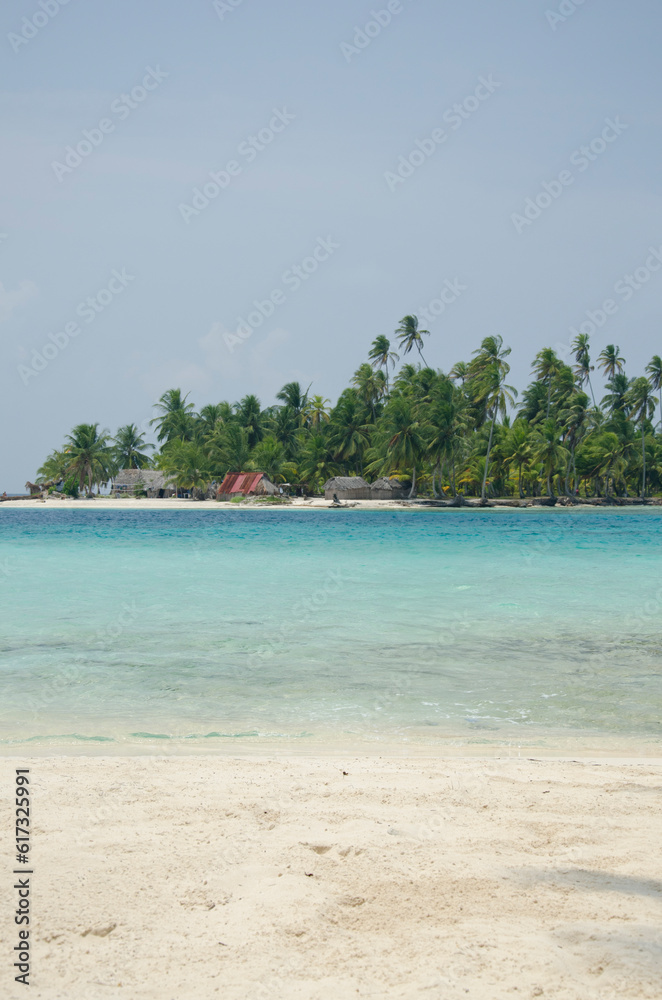 Tropical beach with palm trees during a sunny day, Guna Yala Comarca, Panama - stock photo