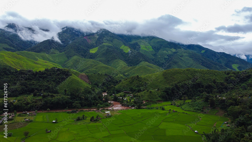 Beautiful aerial view of the green rice field and green mountain, Nan, Thailand. Beautiful aerial view of the green rice field and green mountain, Nan, Thailand.