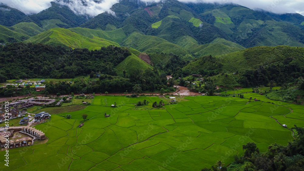 Beautiful aerial view of the green rice field and green mountain, Nan, Thailand. Beautiful aerial view of the green rice field and green mountain, Nan, Thailand.