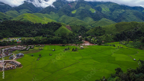 Beautiful aerial view of the green rice field and green mountain, Nan, Thailand.