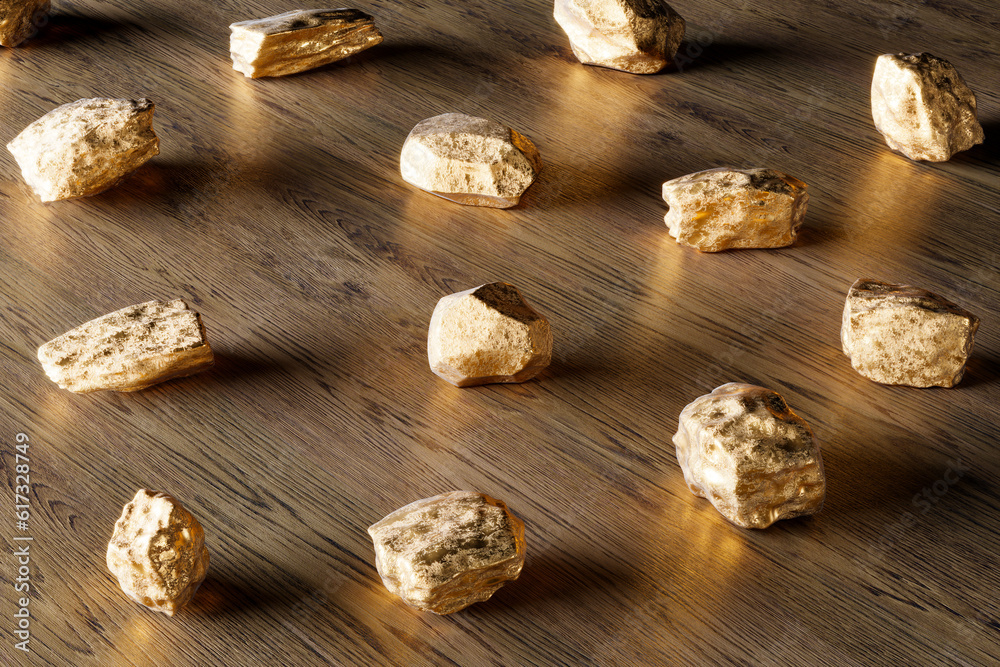 Fototapeta premium A group of pure gold pieces on the wooden background. Golden nuggets. Gold ore