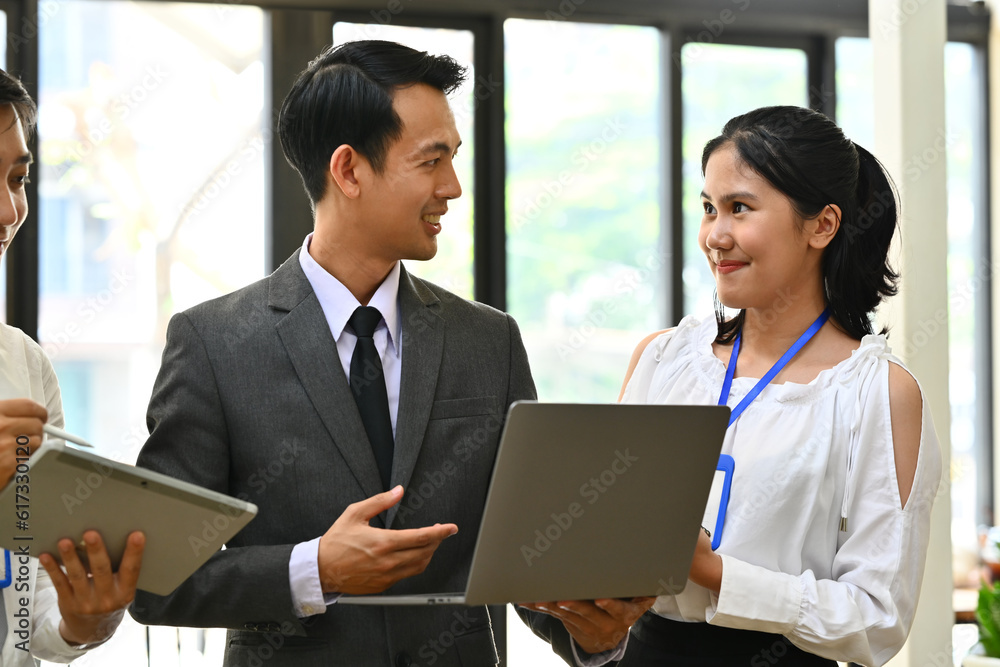 Millennial businessman team leader explaining project details, talking about company strategy and business plan during meeting Millennial businessman team leader explaining project details, talking about company strategy and business plan during meeting