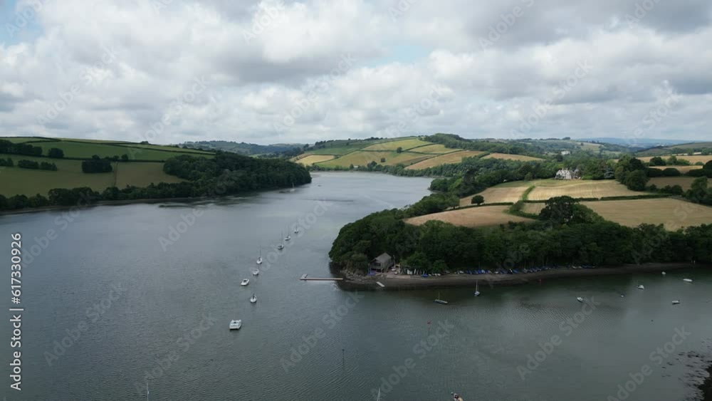 River Dart, near Stoke Gabriel, South Devon, England: DRONE VIEWS: The drone flies North over yachts moored on the River Dart, then over the Stoke Gabriel Boating Association headquarters. River Dart, near Stoke Gabriel, South Devon, England: DRONE VIEWS: The drone flies North over yachts moored on the River Dart, then over the Stoke Gabriel Boating Association headquarters.