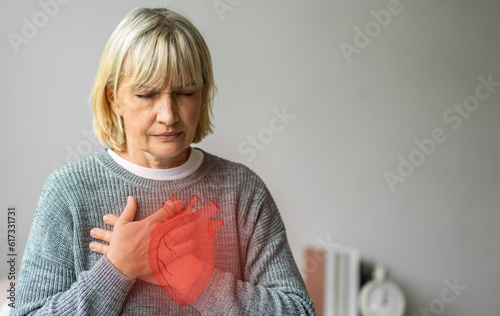 Senior adult elderly woman with chest pain suffering from heart attack, health and medical, heart health,  heart attack, world heart day, cardiovascular disease.insurance and hospital concept