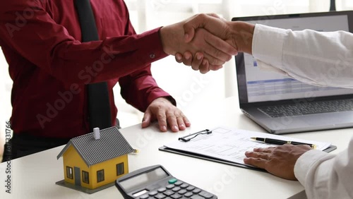 Real estate agents explain models of housing estates in projects to elaborate to clients, explaining and presenting information about homes and purchasing loans. Real estate trading concept. 4k.