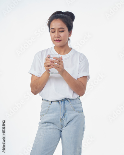 Woman drinking water on white background