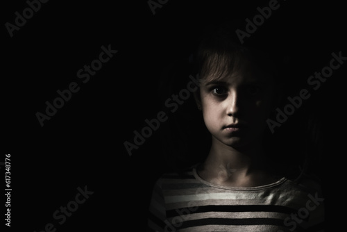Conceptual image: psychological injuries, children's anxieties and fears, lost childhood. Sad unhappy little child girl feel lonely abandoned, children drama. Copy space.
