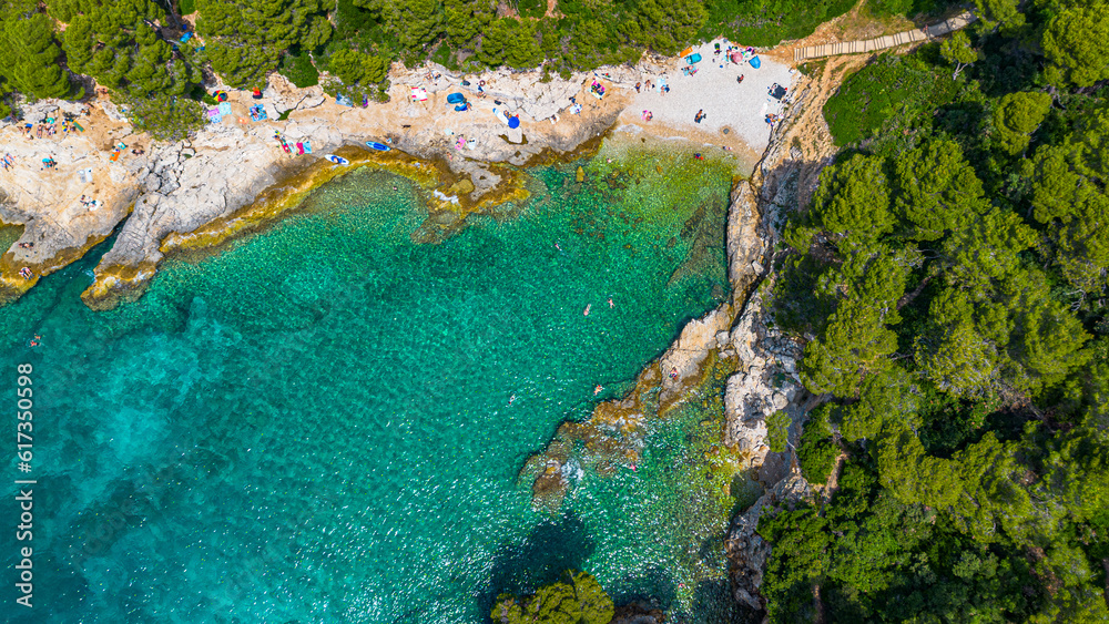 Aerial view of  Famous Cyclone beach near Pula. Rocks in clear water. Istria. Croatia