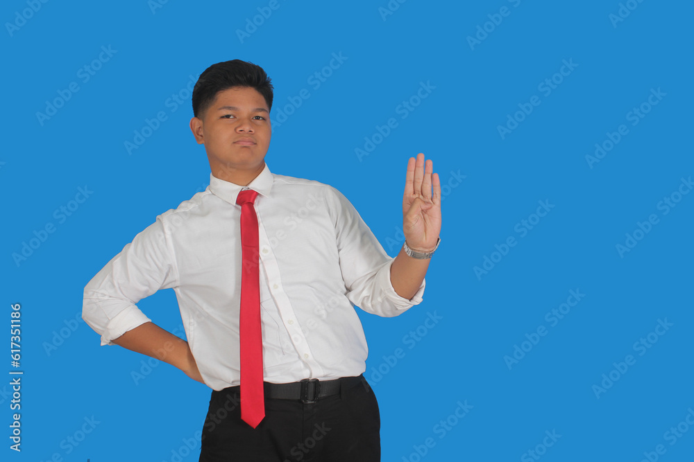 Asian male party cadre in tie pointing up with number four finger smiling confident and happy for election campaign isolated on blue background.
Asian male party cadre in tie pointing up with number four finger smiling confident and happy for election campaign isolated on blue background.