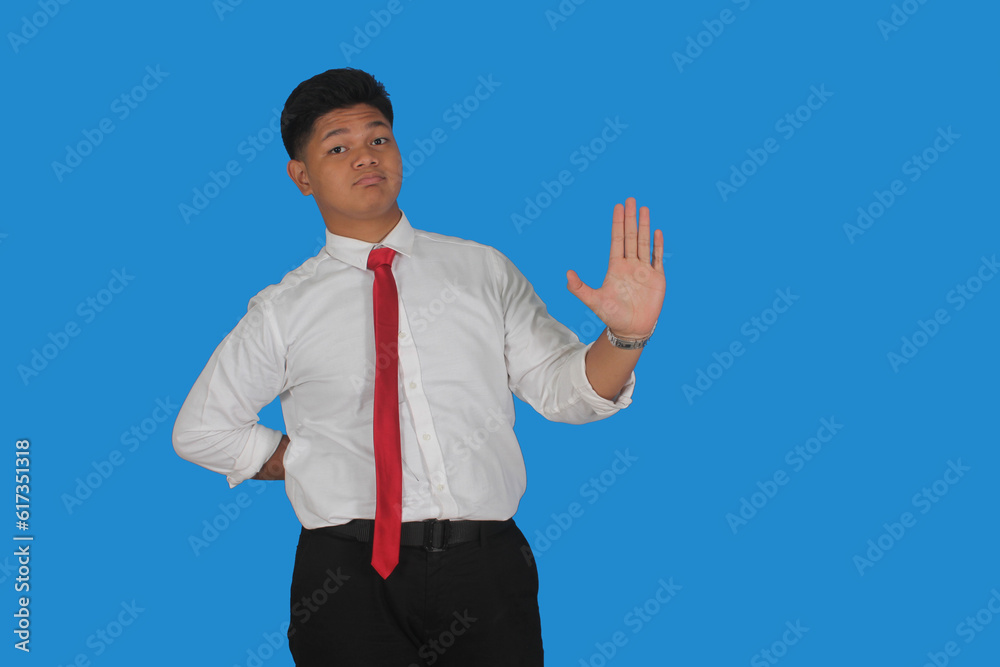 Asian male party cadre in tie pointing up with number five finger smiling confident and happy for election campaign isolated on blue background.
Asian male party cadre in tie pointing up with number five finger smiling confident and happy for election campaign isolated on blue background.