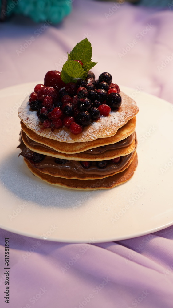 Delicious pancakes with fresh berries