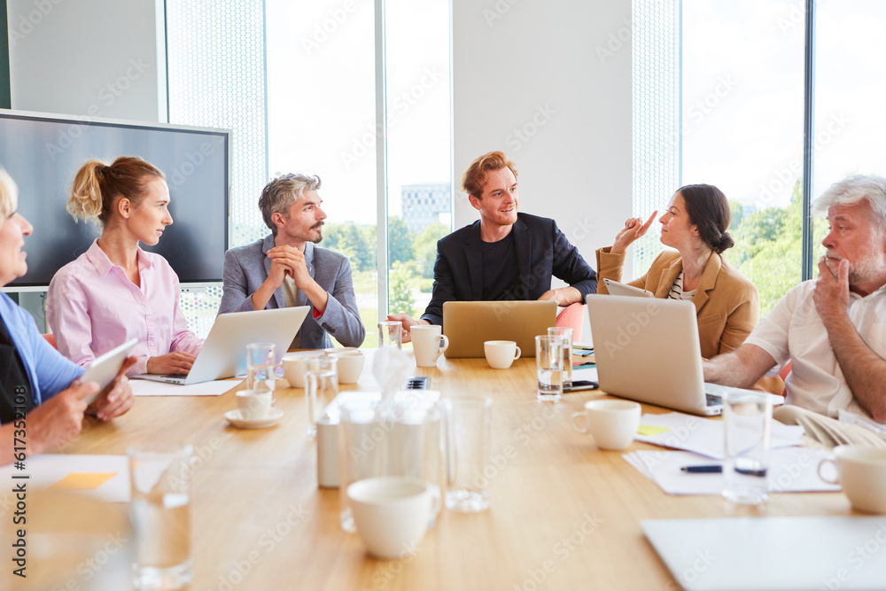 Group of business people having team meeting in the office Group of business people having team meeting in the office
