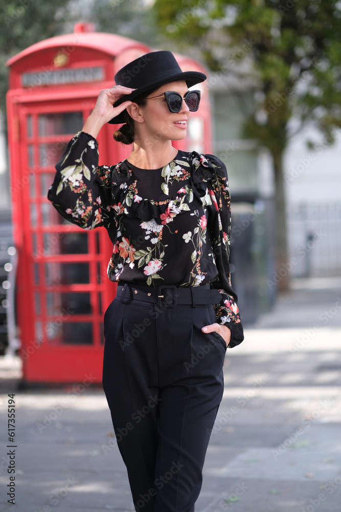 Elegant woman in stylish clothes on London streets. Elegant woman in stylish clothes on London streets.