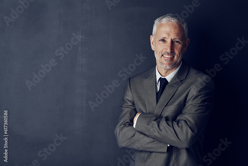 Smile, confidence and portrait of lawyer in mockup, arms crossed and smile on dark background in studio space. Boss, ceo and happy attorney with happy professional career, senior law firm executive.