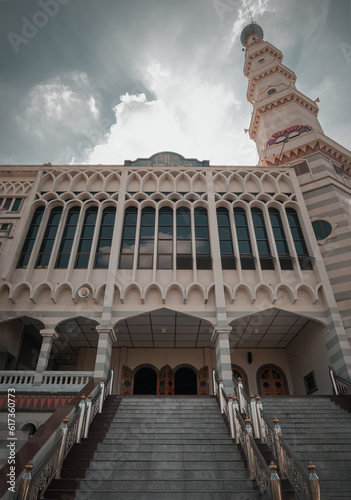 Architecture Design View of Al Alawi Mosque with Tower at Afternoon. Detail of Exterior Building Built for Islamic Affairs are designed with elegant. Muslim mosque, Islamic art concept, Space for text photo