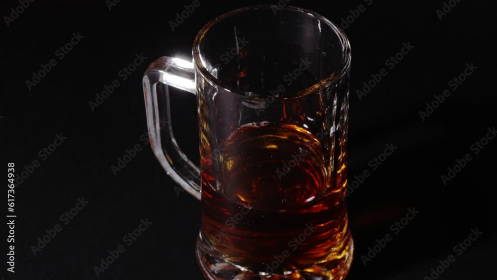 Beer is poured into stop motion into the glass Beer is poured into stop motion into the glass
