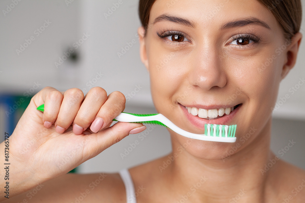 Happy Lady Brushing Teeth With Toothbrush Standing In Bathroom Happy Lady Brushing Teeth With Toothbrush Standing In Bathroom