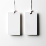 two white fashion label mockups isolated on white background. Generative AI