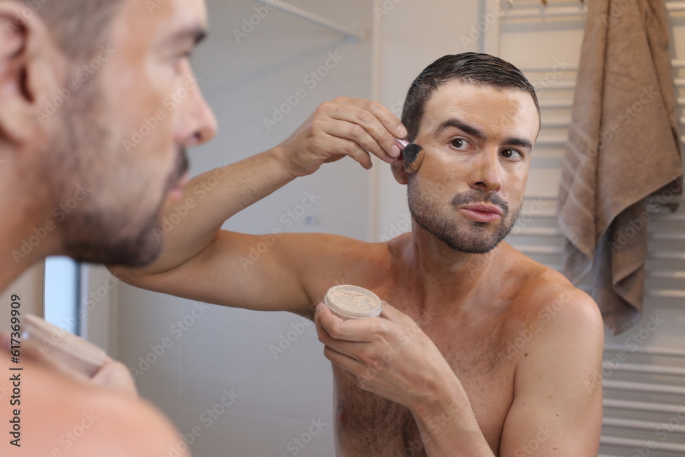 Fototapeta premium Man applying too much make up on face