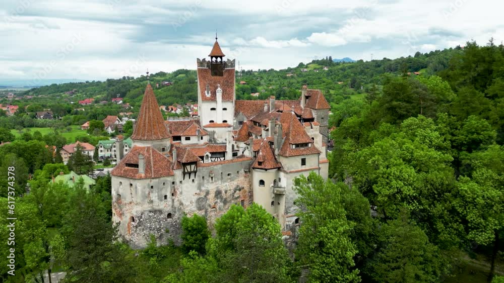 Cinematic aerial view of Bran Castle. Located in Transylvania, Romania, this castle is known because of the Dracula stories. Represents one of the best-known tourist attractions of Romania. Backwards
Cinematic aerial view of Bran Castle. Located in Transylvania, Romania, this castle is known because of the Dracula stories. Represents one of the best-known tourist attractions of Romania. Backwards