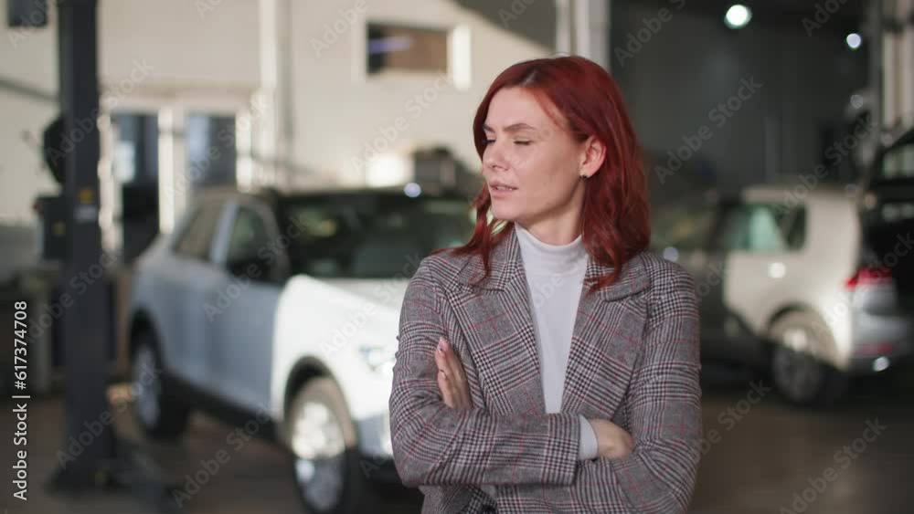 car service, distressed woman owner of car is upset because of a broken engine, stands background of transport at inspection