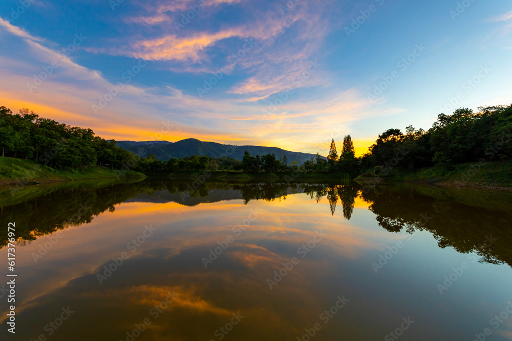 Beautiful sunset sky with reflection of the lake at Khao Yai national park, Thailand