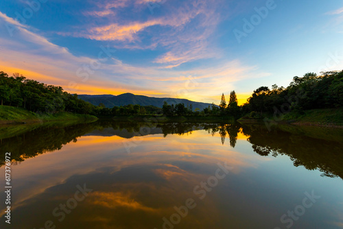 Beautiful sunset sky with reflection of the lake at Khao Yai national park, Thailand © Akarawut