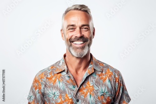 Portrait of a happy mature man smiling at camera over white background