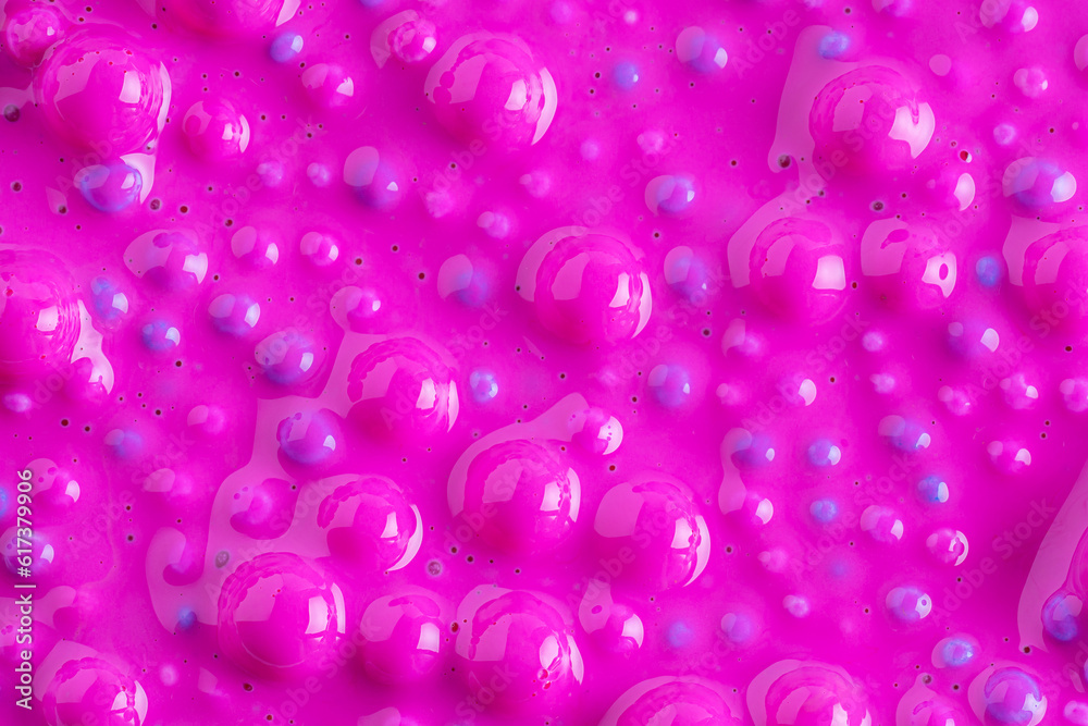 Balls in pink paint, abstract colorful background. Background with colorful balls in different sizes. Sphere of balls on pastel color.