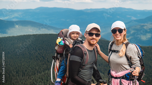 A family with a baby in the mountains
