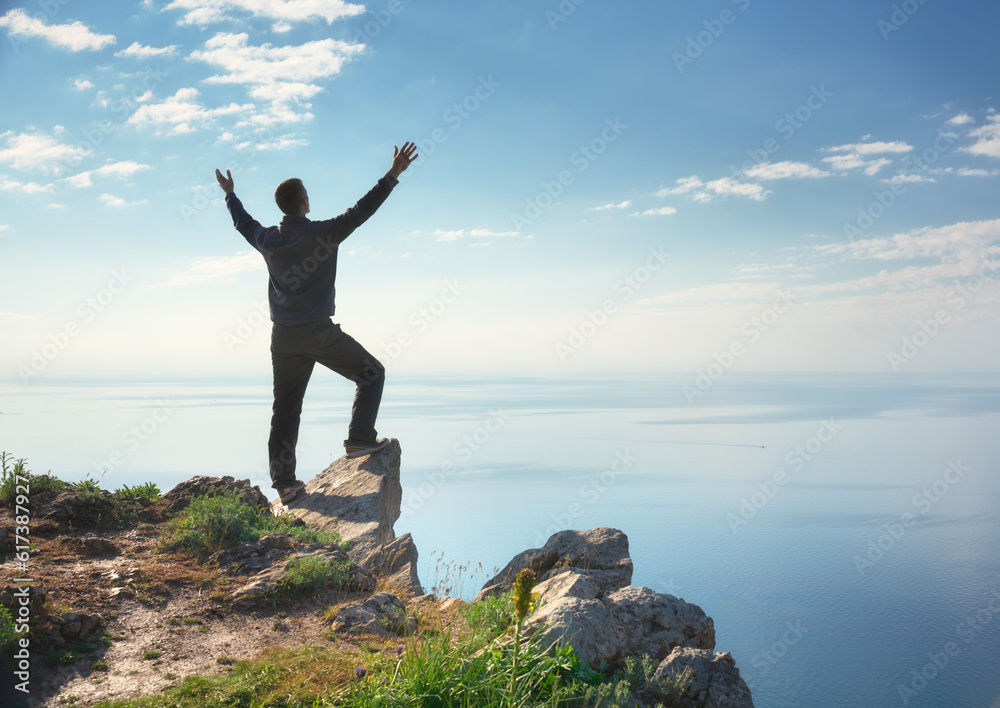 Man on sea cliff edge. Man on sea cliff edge.