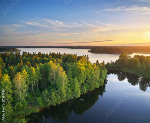 Fototapeta Naklejka Na Ścianę i Meble -  Lake and forest during sunset.