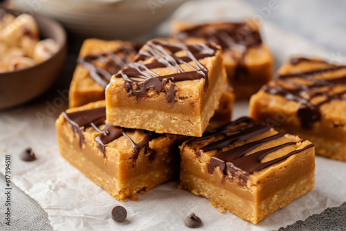 chocolate chip cookie bars bites on a white plate with milk