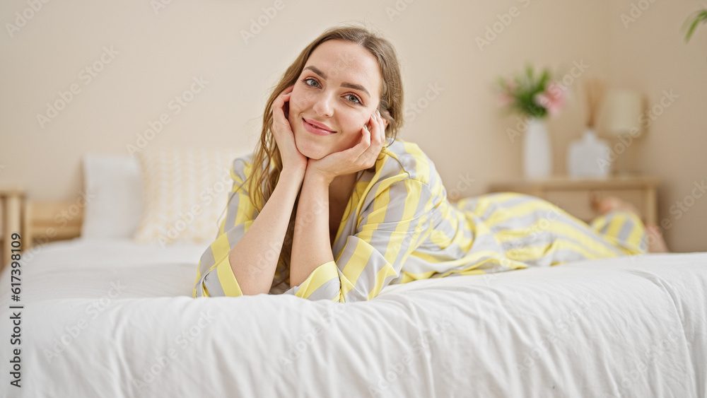 Young blonde woman smiling confident lying on bed at bedroom Young blonde woman smiling confident lying on bed at bedroom