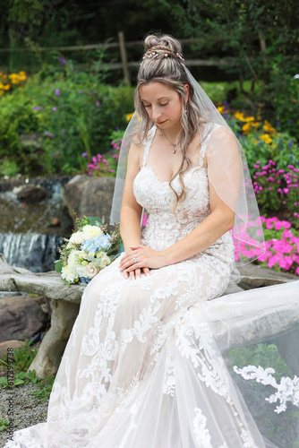Solemn Wedding Bride Wears White Dress, Looks Down, Meditates, and Prays at Wedding