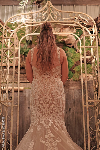 Bride in A White Dress Faced Toward the Alter During Wedding